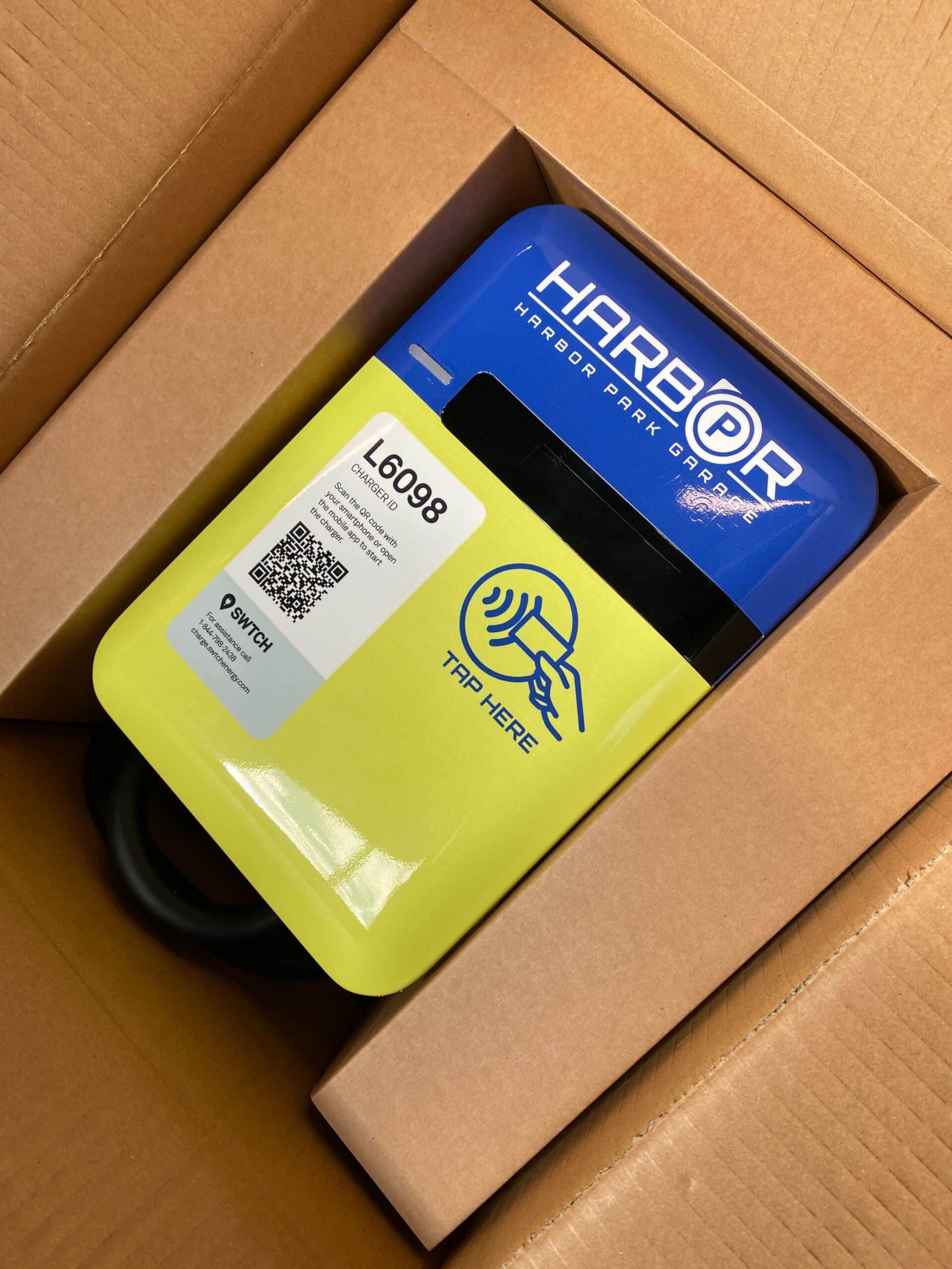 Harbor Park charger in a box, labeled with a QR code and 