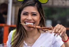 A woman wearing pickle-shaped headbands and a 